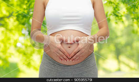 To use this stock image in your creative project, please select the size you need over to the right and click the "Add to Cart" button.
Your downloaded image will come with the Cutcaster watermark removed so don’t worry about the watermark you see on this page. close up of pregnant woman making heart gesture stock photo, pregnancy, love, people and expectation concept - close up of pregnant woman making heart gesture over green natural background by Syda Productions