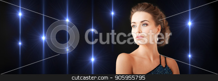 To use this stock image in your creative project, please select the size you need over to the right and click the "Add to Cart" button.
Your downloaded image will come with the Cutcaster watermark removed so don’t worry about the watermark you see on this page. gorgeous woman with diamond earrings stock photo, beauty and glamour concept - gorgeous woman in evening dress and diamond earrings on black background with shiny lights by Syda Productions