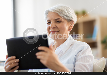 To use this stock image in your creative project, please select the size you need over to the right and click the "Add to Cart" button.
Your downloaded image will come with the Cutcaster watermark removed so don’t worry about the watermark you see on this page. happy senior woman with tablet pc at home stock photo, technology, age and people concept - happy senior woman with tablet pc computer at home by Syda Productions