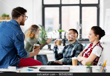 To use this stock image in your creative project, please select the size you need over to the right and click the "Add to Cart" button.
Your downloaded image will come with the Cutcaster watermark removed so don’t worry about the watermark you see on this page. creative team drinking coffee at office stock photo, business and people concept - happy creative team drinking coffee at office by Syda Productions