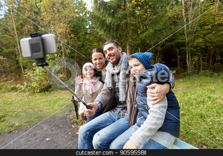 To use this stock image in your creative project, please select the size you need over to the right and click the "Add to Cart" button.
Your downloaded image will come with the Cutcaster watermark removed so don’t worry about the watermark you see on this page. family taking photo by selfie stick outdoors stock photo, family, tourism and technology concept - happy mother, father, son and daughter taking picture by smartphone on selfie stick in woods by Syda Productions