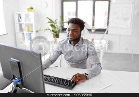 To use this stock image in your creative project, please select the size you need over to the right and click the "Add to Cart" button.
Your downloaded image will come with the Cutcaster watermark removed so don’t worry about the watermark you see on this page. businessman with headphones and computer at office stock photo, business, technology and people concept - happy african american businessman with headphones and computer listening to music at office by Syda Productions