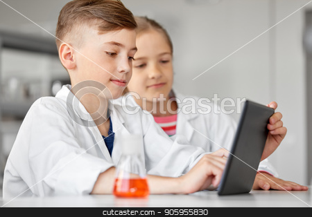 To use this stock image in your creative project, please select the size you need over to the right and click the "Add to Cart" button.
Your downloaded image will come with the Cutcaster watermark removed so don’t worry about the watermark you see on this page. kids with tablet pc at school laboratory stock photo, education, science and technology concept - kids with tablet pc computer studying chemistry at school laboratory by Syda Productions