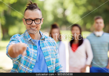 To use this stock image in your creative project, please select the size you need over to the right and click the "Add to Cart" button.
Your downloaded image will come with the Cutcaster watermark removed so don’t worry about the watermark you see on this page. group of happy international friends outdoors stock photo, people, friendship and gesture concept - happy smiling man in glasses pointing at you and group of happy friends outdoors by Syda Productions