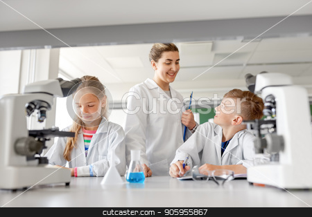 To use this stock image in your creative project, please select the size you need over to the right and click the "Add to Cart" button.
Your downloaded image will come with the Cutcaster watermark removed so don’t worry about the watermark you see on this page. teacher and students studying chemistry at school stock photo, education, science and children concept - teacher and students studying chemistry at school laboratory and writing to workbooks by Syda Productions