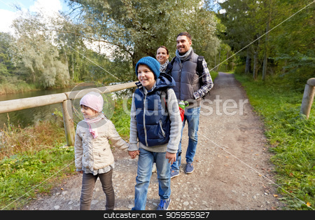 To use this stock image in your creative project, please select the size you need over to the right and click the "Add to Cart" button.
Your downloaded image will come with the Cutcaster watermark removed so don’t worry about the watermark you see on this page. family with backpacks hiking or walking in woods stock photo, family, tourism and hiking concept - happy mother, father, son and daughter with backpacks walking in woods by Syda Productions