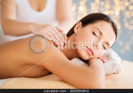 To use this stock image in your creative project, please select the size you need over to the right and click the "Add to Cart" button.
Your downloaded image will come with the Cutcaster watermark removed so don’t worry about the watermark you see on this page. close up of beautiful woman having massage at spa stock photo, wellness, spa and beauty concept - close up of beautiful woman having massage over holidays lights background by Syda Productions