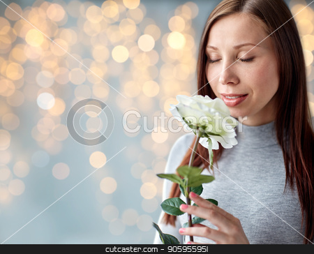 To use this stock image in your creative project, please select the size you need over to the right and click the "Add to Cart" button.
Your downloaded image will come with the Cutcaster watermark removed so don’t worry about the watermark you see on this page. woman smelling white rose over festive lights stock photo, people and flowers concept - happy young woman smelling big white rose over festive lights background by Syda Productions