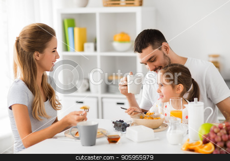 To use this stock image in your creative project, please select the size you need over to the right and click the "Add to Cart" button.
Your downloaded image will come with the Cutcaster watermark removed so don’t worry about the watermark you see on this page. happy family having breakfast at home stock photo, family, eating and people concept - happy mother, father and daughter having breakfast at home by Syda Productions