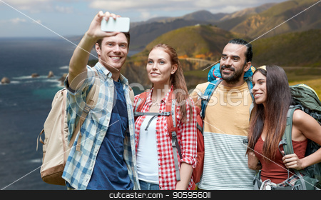 To use this stock image in your creative project, please select the size you need over to the right and click the "Add to Cart" button.
Your downloaded image will come with the Cutcaster watermark removed so don’t worry about the watermark you see on this page. friends with backpack taking selfie by smartphone stock photo, technology, travel, tourism, hike and people concept - group of smiling friends with backpacks taking selfie by smartphone over bixby creek bridge on big sur coast of california background by Syda Productions