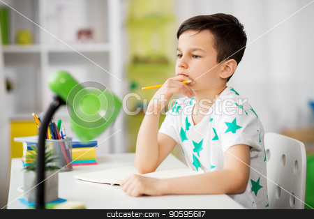 To use this stock image in your creative project, please select the size you need over to the right and click the "Add to Cart" button.
Your downloaded image will come with the Cutcaster watermark removed so don’t worry about the watermark you see on this page. little boy writing to notebook at home stock photo, education, childhood and school concept - little boy sitting at desk and writing to notebook at home by Syda Productions