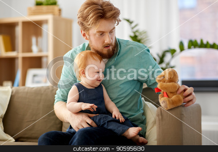 To use this stock image in your creative project, please select the size you need over to the right and click the "Add to Cart" button.
Your downloaded image will come with the Cutcaster watermark removed so don’t worry about the watermark you see on this page. father and baby daughter with teddy bear at home stock photo, family, fatherhood and people concept - happy red haired father and little baby daughter playing with teddy bear at home by Syda Productions