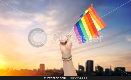 To use this stock image in your creative project, please select the size you need over to the right and click the "Add to Cart" button.
Your downloaded image will come with the Cutcaster watermark removed so don’t worry about the watermark you see on this page. hand with gay pride rainbow flags and wristband stock photo, lgbt, same-sex relationships and homosexual concept - close up of male hand with gay pride awareness wristband holding rainbow flags over sunset in tallinn city background by Syda Productions