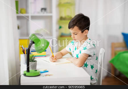 To use this stock image in your creative project, please select the size you need over to the right and click the "Add to Cart" button.
Your downloaded image will come with the Cutcaster watermark removed so don’t worry about the watermark you see on this page. little boy writing to notebook at home stock photo, education, childhood and school concept - little boy sitting at desk and writing to notebook at home by Syda Productions