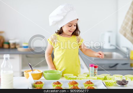 To use this stock image in your creative project, please select the size you need over to the right and click the "Add to Cart" button.
Your downloaded image will come with the Cutcaster watermark removed so don’t worry about the watermark you see on this page. little girl in chefs toque baking muffins at home stock photo, family, cooking and people concept - little girl in chefs toque baking muffins or cupcakes with sprinkles at home by Syda Productions