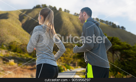 To use this stock image in your creative project, please select the size you need over to the right and click the "Add to Cart" button.
Your downloaded image will come with the Cutcaster watermark removed so don’t worry about the watermark you see on this page. couple with earphones running over big sur stock photo, fitness, sport and technology concept - happy couple running and listening to music in earphones over big sur hills background in california by Syda Productions