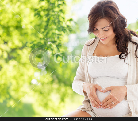 To use this stock image in your creative project, please select the size you need over to the right and click the "Add to Cart" button.
Your downloaded image will come with the Cutcaster watermark removed so don’t worry about the watermark you see on this page. happy pregnant woman making heart gesture stock photo, pregnancy, love, people and expectation concept - happy pregnant woman making heart gesture over green natural background by Syda Productions