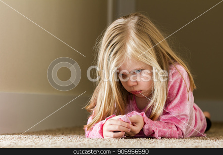 To use this stock image in your creative project, please select the size you need over to the right and click the "Add to Cart" button.
Your downloaded image will come with the Cutcaster watermark removed so don’t worry about the watermark you see on this page. Child laying in the hallway sad stock photo, Child could be sad due to abuse, domestic violence, or even sad due to a bully by txking