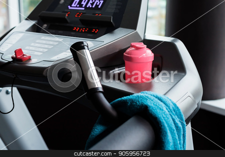 To use this stock image in your creative project, please select the size you need over to the right and click the "Add to Cart" button.
Your downloaded image will come with the Cutcaster watermark removed so don’t worry about the watermark you see on this page. treadmill with towel and shaker stock photo, modern treadmill with blue towel and pink shaker standing on it. concept of sports equipment by Oleh