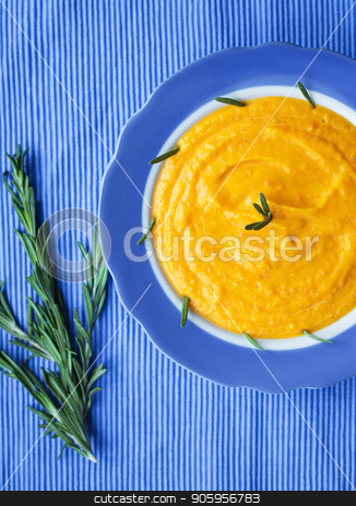 To use this stock image in your creative project, please select the size you need over to the right and click the "Add to Cart" button.
Your downloaded image will come with the Cutcaster watermark removed so don’t worry about the watermark you see on this page. pumpkin cream soup in a blue plate on blue napkin, a branch of rosemary stock photo, pumpkin cream soup in a blue plate on blue napkin, a branch of rosemary. by Sergiy Artsaba