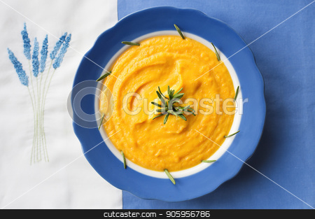 To use this stock image in your creative project, please select the size you need over to the right and click the "Add to Cart" button.
Your downloaded image will come with the Cutcaster watermark removed so don’t worry about the watermark you see on this page. pumpkin soup in a blue plate with rosemary on a napkin with flowers stock photo, pumpkin soup in a blue plate with rosemary on a napkin with flowers. by Sergiy Artsaba