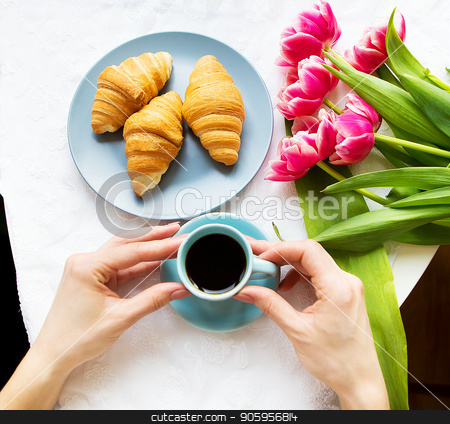 To use this stock image in your creative project, please select the size you need over to the right and click the "Add to Cart" button.
Your downloaded image will come with the Cutcaster watermark removed so don’t worry about the watermark you see on this page. Girl with croissants and coffee, a bouquet of pink tulips, happy morning stock photo, Girl with croissants and coffee, a bouquet of pink tulips, happy morning. by Sergiy Artsaba