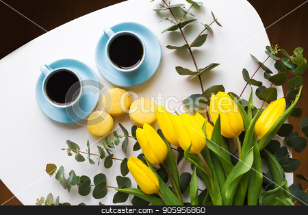 To use this stock image in your creative project, please select the size you need over to the right and click the "Add to Cart" button.
Your downloaded image will come with the Cutcaster watermark removed so don’t worry about the watermark you see on this page. freshly brewed coffee stock photo, two blue cup of coffee with yellow tulips on an old table, top view by Sergiy Artsaba
