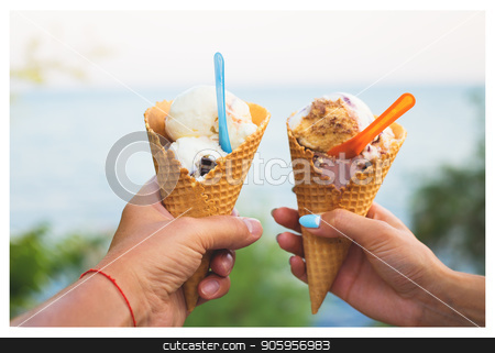 To use this stock image in your creative project, please select the size you need over to the right and click the "Add to Cart" button.
Your downloaded image will come with the Cutcaster watermark removed so don’t worry about the watermark you see on this page. Beautiful bright ice cream with different flavors in the hands of a couple stock photo, Beautiful bright ice cream with different flavors in the hands of a couple. by Sergiy Artsaba