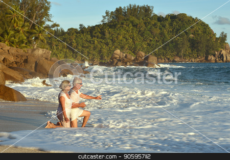 To use this stock image in your creative project, please select the size you need over to the right and click the "Add to Cart" button.
Your downloaded image will come with the Cutcaster watermark removed so don’t worry about the watermark you see on this page. elderly couple resting on tropical resort stock photo, beautiful elderly couple resting on tropical resort by Ruslan Huzau