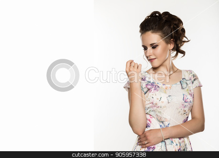 To use this stock image in your creative project, please select the size you need over to the right and click the "Add to Cart" button.
Your downloaded image will come with the Cutcaster watermark removed so don’t worry about the watermark you see on this page. young elegant woman with professional hairstyle poses on a white background. free space for your text stock photo, young elegant woman with professional hairstyle poses on a white background. by Alexander
