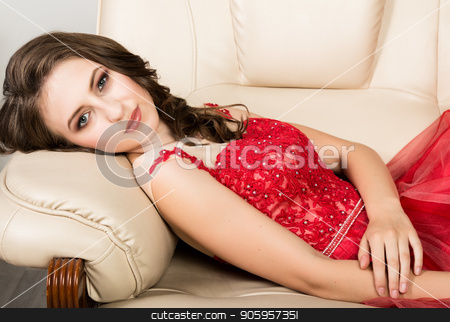 To use this stock image in your creative project, please select the size you need over to the right and click the "Add to Cart" button.
Your downloaded image will come with the Cutcaster watermark removed so don’t worry about the watermark you see on this page. young elegant woman with professional hairstyle in long red dress rested on sofa stock photo, young elegant woman with professional hairstyle in long red dress rested on sofa. by Alexander