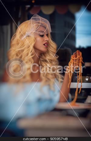 To use this stock image in your creative project, please select the size you need over to the right and click the "Add to Cart" button.
Your downloaded image will come with the Cutcaster watermark removed so don’t worry about the watermark you see on this page. Pasta in the cafe stock photo, Food, people and leisure creative concept - beauty blonde young woman eating pasta in cafe by olinchuk