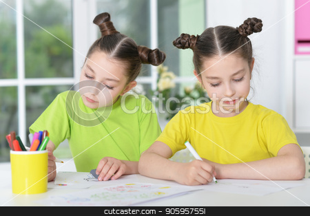 To use this stock image in your creative project, please select the size you need over to the right and click the "Add to Cart" button.
Your downloaded image will come with the Cutcaster watermark removed so don’t worry about the watermark you see on this page. girls on lesson of art stock photo, portrait of Cute twin sisters drawing together at home by Ruslan Huzau