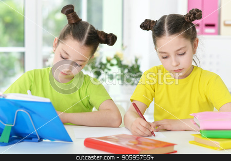 To use this stock image in your creative project, please select the size you need over to the right and click the "Add to Cart" button.
Your downloaded image will come with the Cutcaster watermark removed so don’t worry about the watermark you see on this page. two sisters twins stock photo, Cute twin sisters doing homework at their room by Ruslan Huzau