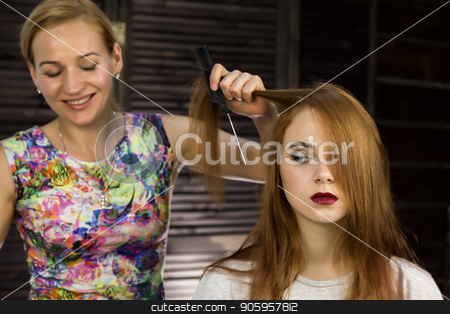 To use this stock image in your creative project, please select the size you need over to the right and click the "Add to Cart" button.
Your downloaded image will come with the Cutcaster watermark removed so don’t worry about the watermark you see on this page. Hairdresser does hairstyle for young woman to weave braids. Concept beauty and wedding stock photo, Hairdresser does hairstyle for young woman to weave braids. Concept beauty and wedding. by Alexander