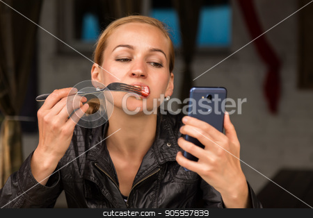 To use this stock image in your creative project, please select the size you need over to the right and click the "Add to Cart" button.
Your downloaded image will come with the Cutcaster watermark removed so don’t worry about the watermark you see on this page. businesswoman eating salad in an outdoor cafe. Healthy lifestyle: girl eating green tasty food and checks email on your phone stock photo, businesswoman eating salad in an outdoor cafe. Healthy lifestyle: girl eating green tasty food by Alexander