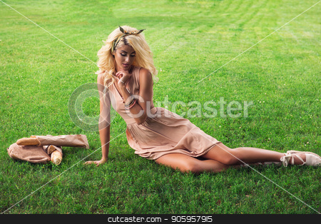 To use this stock image in your creative project, please select the size you need over to the right and click the "Add to Cart" button.
Your downloaded image will come with the Cutcaster watermark removed so don’t worry about the watermark you see on this page. Beauty blonde alone young woman resting in the park stock photo, Rest in park, food, and people concept - beauty blonde young woman resting in the park by olinchuk