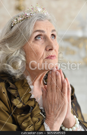 To use this stock image in your creative project, please select the size you need over to the right and click the "Add to Cart" button.
Your downloaded image will come with the Cutcaster watermark removed so don’t worry about the watermark you see on this page. Portrait of beautiful senior woman Queen stock photo, Portrait of beautiful senior woman Queen posing indoors by Ruslan Huzau