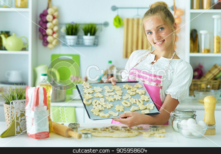 To use this stock image in your creative project, please select the size you need over to the right and click the "Add to Cart" button.
Your downloaded image will come with the Cutcaster watermark removed so don’t worry about the watermark you see on this page. young girl in the kitchen stock photo, young girl in the kitchen making cookies by Ruslan Huzau