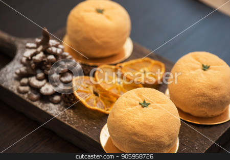 To use this stock image in your creative project, please select the size you need over to the right and click the "Add to Cart" button.
Your downloaded image will come with the Cutcaster watermark removed so don’t worry about the watermark you see on this page. Tasty dessert for xmas stock photo, Tasty dessert as orange fruit with chocolate fir-tree for new year holiday by olinchuk