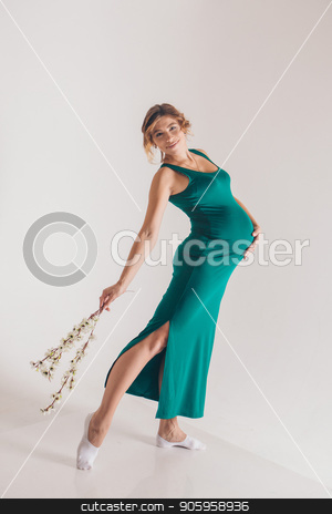 To use this stock image in your creative project, please select the size you need over to the right and click the "Add to Cart" button.
Your downloaded image will come with the Cutcaster watermark removed so don’t worry about the watermark you see on this page. pregnant ballerina dancing on a white background. Future mother in a green dress posing stock photo, pregnant ballerina dancing on a white background. Future mother in a green dress posing by aaalll3110