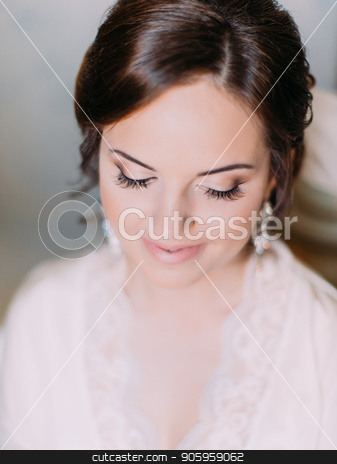 To use this stock image in your creative project, please select the size you need over to the right and click the "Add to Cart" button.
Your downloaded image will come with the Cutcaster watermark removed so don’t worry about the watermark you see on this page. Down view of the lovely bride with the perfect makeup. stock photo, Down view of the lovely bride with the perfect makeup by Andrii Kobryn