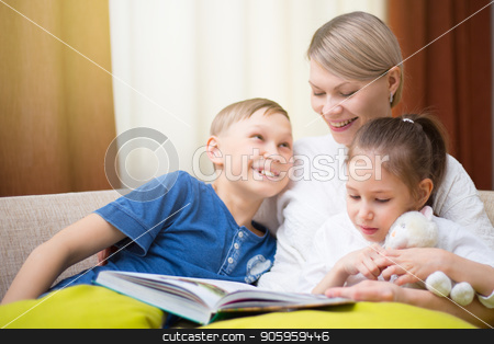 To use this stock image in your creative project, please select the size you need over to the right and click the "Add to Cart" button.
Your downloaded image will come with the Cutcaster watermark removed so don’t worry about the watermark you see on this page. Beautiful mother is reading a book to her young children. Sister and brother is listening to a story. stock photo, Beautiful mother is reading a book to her young children. Sister and brother is listening to a story. Happy loving family. by Alfira Poyarkova