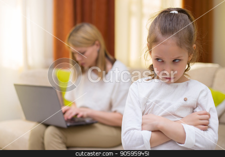 To use this stock image in your creative project, please select the size you need over to the right and click the "Add to Cart" button.
Your downloaded image will come with the Cutcaster watermark removed so don’t worry about the watermark you see on this page. Sadness young girl. Portrait of bored daughter with mother using cellphone on sofa. stock photo, Sadness young girl. Portrait of bored daughter with mother using notebook on sofa. Family relationships. by Alfira Poyarkova