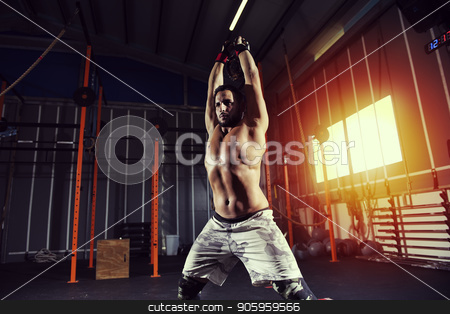 To use this stock image in your creative project, please select the size you need over to the right and click the "Add to Cart" button.
Your downloaded image will come with the Cutcaster watermark removed so don’t worry about the watermark you see on this page. Athletic man works out at the gym with a kettlebel stock photo, Determined athletic man works out at the gym with a kettlebel by Federico Caputo