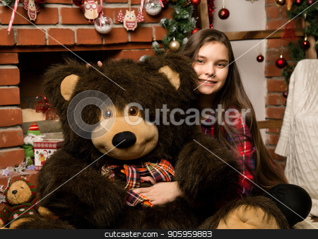To use this stock image in your creative project, please select the size you need over to the right and click the "Add to Cart" button.
Your downloaded image will come with the Cutcaster watermark removed so don’t worry about the watermark you see on this page. teenag girl is embraces a big big teddy bear on christmas near fireplace stock photo, teenag girl is embraces a big big teddy bear on christmas near fireplace. by Alexander