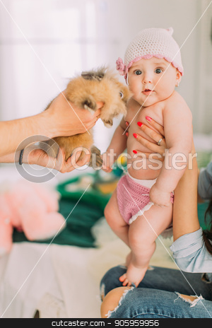To use this stock image in your creative project, please select the size you need over to the right and click the "Add to Cart" button.
Your downloaded image will come with the Cutcaster watermark removed so don’t worry about the watermark you see on this page. The vertical portrait of the lovely baby. The father is showing the rabbit. stock photo, The vertical portrait of the lovely baby. The father is showing the rabbit by Andrii Kobryn