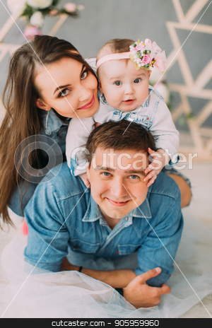 To use this stock image in your creative project, please select the size you need over to the right and click the "Add to Cart" button.
Your downloaded image will come with the Cutcaster watermark removed so don’t worry about the watermark you see on this page. Close-up portrait of the happy family. Mother is hugging the baby while she is sitting on the shoulders of the father. stock photo, Close-up portrait of the happy family. Mother is hugging the baby while she is sitting on the shoulders of the father by Andrii Kobryn