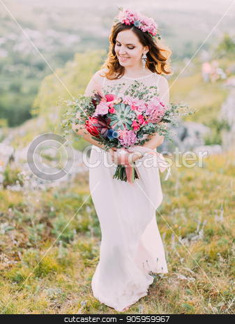 To use this stock image in your creative project, please select the size you need over to the right and click the "Add to Cart" button.
Your downloaded image will come with the Cutcaster watermark removed so don’t worry about the watermark you see on this page. The up view of the smiling bride holding the huge wedding bouquet in the mountains. stock photo, The up view of the smiling bride holding the huge wedding bouquet in the mountains by Andrii Kobryn