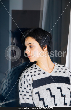 To use this stock image in your creative project, please select the size you need over to the right and click the "Add to Cart" button.
Your downloaded image will come with the Cutcaster watermark removed so don’t worry about the watermark you see on this page. Beautiful girl standing at the window watching. stock photo, Lonely girl near window thinking about something. Melancholy reflection of the girl in the window. Sad and anxious girl standing near the window. by Vera Arsic